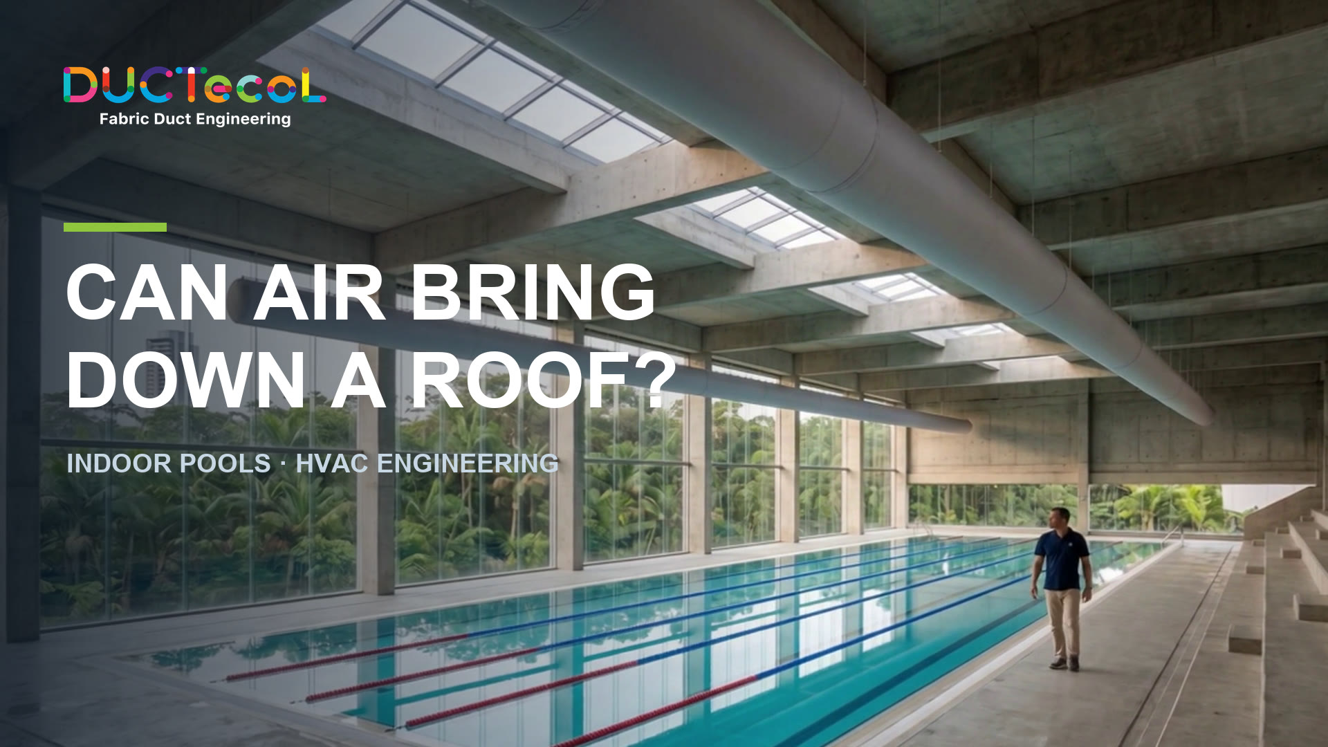 Fabric duct suspended from a steel cable above the water surface of an indoor swimming pool with concrete structure